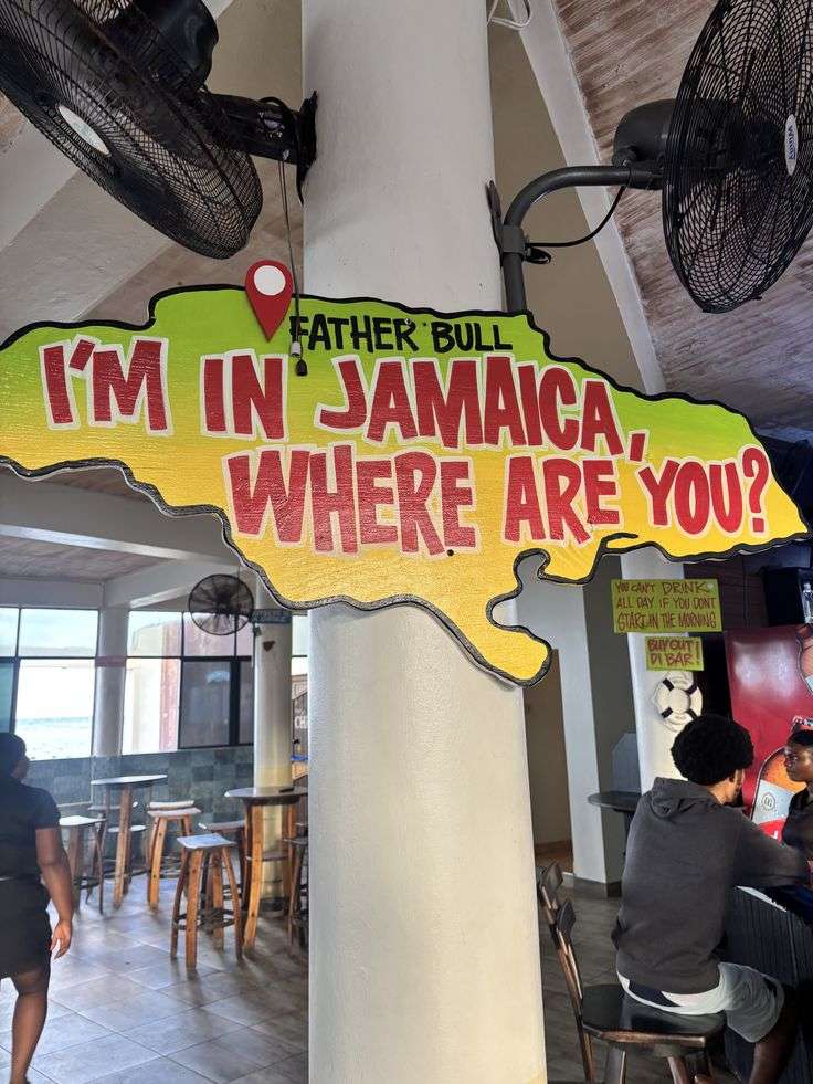 Father Bull restaurant interior with Jamaican signage